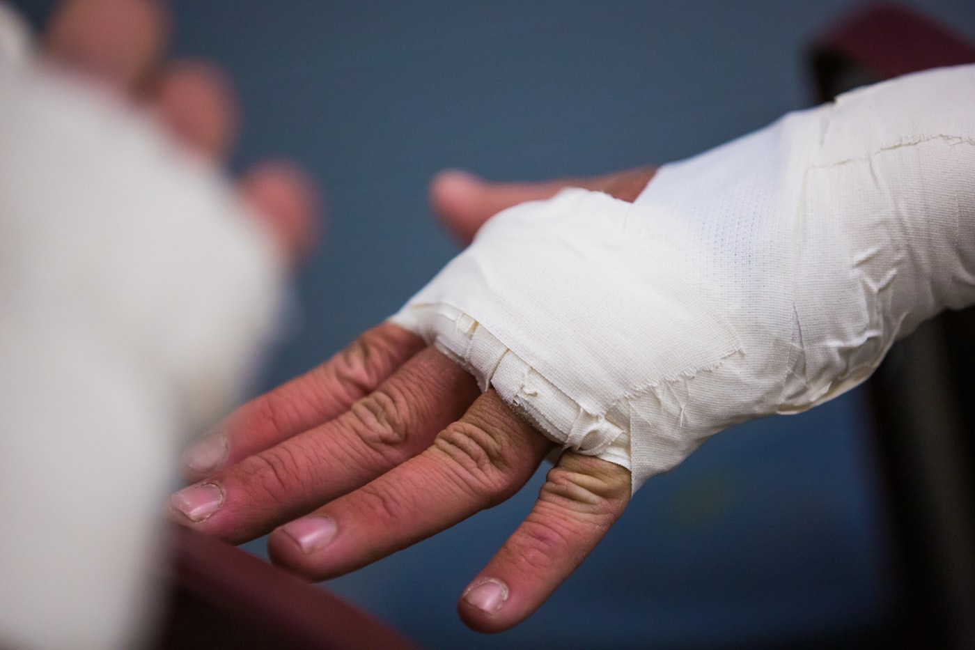 A bandaged hand resting open at a follow-up visit